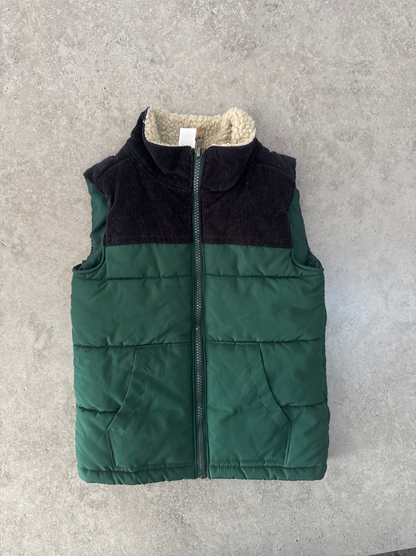 Carter's green puffer vest with a black corduroy yoke and sherpa collar